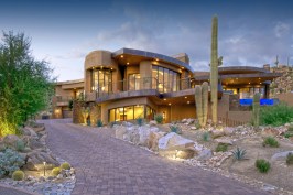 FRONT ELEVATION
Set into rising canyon landscape, multiple rooflines help blend the home into nature.