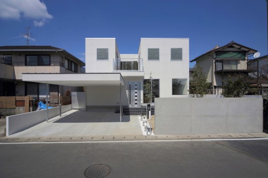 The sky is framed by the wall of the house.