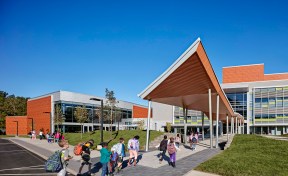 Canopy provides weather protection at the bus drop-off.
A spine of pavers draws students into the three story atrium.