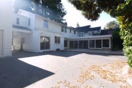 Before- Exterior view of rear of Kitchen and Family Room