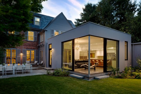 The new 536 sq ft. polished modern addition that links together the existing home and pool-house, blending traditional and modern to create a defined space for family to gather. 