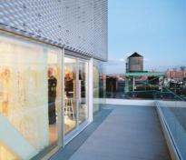 Terraces along the east and south sides of the museum's seventh floor multi-purpose event space allow full engagement with the city.