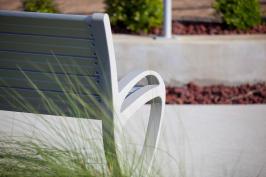 Trio Bench shown in 6 foot, backed configuration with Aluminum Texture powdercoated frame and clear anodized aluminum slats at Page Field, Fort Meyers, Florida