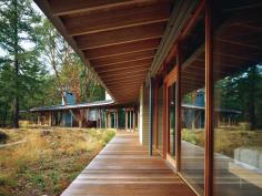 Built on an ecologically sensitive island site, Suncrest bends a linear plan around an existing rock outcropping. The layout creates water views that change as one moves through the house.