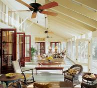 This weekend home allots as much space to this splendid screened porch as it does to kitchen, dining, and living functions combined.