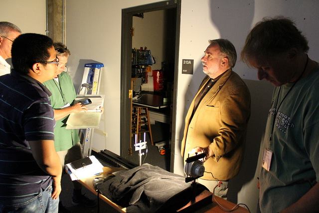 Students work with David DiLaura, professor emeritus at CU-Boulder, during a photometry exercise.