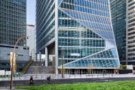 The tower has two entries, one at grade (pictured), and one on the plinth that defines the ground plane of the development at La Défense.