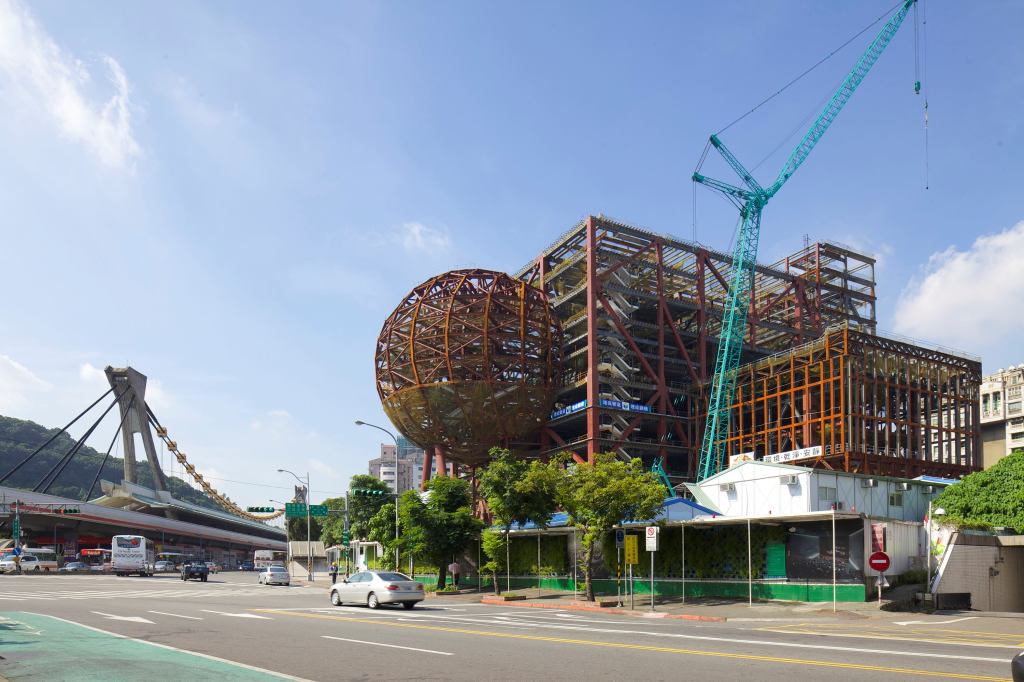 Construction on the Taipei Performing Arts Center in Taiwan, designed by OMA, tops out Wednesday.