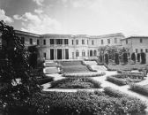 The U.S. Embassy in Havana can be seen in this April 24, 1942, photograph, with its garden in the foreground, which had been built on the outskirts of the city on a hill overlooking the sea. The two-story stone mansion, which was occupied by American ambassador to Cuba Spruille Braden, was constructed at a cost of $300,000. It had eight master bedrooms, seven master baths, four dressing rooms, a great reception, living and dining rooms, three kitchens and service pantries, porches, terraces, and servants quarters.