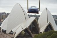 Launched skyward in the early hours of the morning by crane, this GT convertible Mustang ascended a Sydney high-rise building next to the Opera House and Sydney Harbour Bridge to prepare for a breathtaking view of one of the world's most iconic New Year's Eve events. This caps a history-making year in which the Mustang also scaled the Empire State Building and Burj Khalifa, the world's tallest skyscraper in Dubai, to celebrate the iconic pony car's 50th Anniversary.