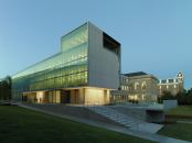 An exterior view at dusk of the new Steven L. Anderson Design Center and Vol Walker Hall in the background.