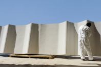 A worker at Kreysler & Associate’s shop, in the San Francisco Bay Area, finishes a Fireshield 285 panel, which will be installed at the San Francisco Museum of Modern Art.