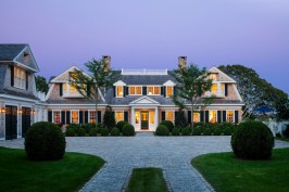 Primary+fa%c3%a7ade+detail+at+dusk.+Note+the+breakdown+of+planes+on+the+main+fa%c3%a7ade.+The+oversailing+gables+break+down+the+size+of+the+house%e2%80%99s+main+gables+with+their+protruding+fa%c3%a7ades+and+inset+windows.+The+dynamic+of+the+protruding+and+inset+facades+and+windows+creates+visual+interest+in+the+primary+fa%c3%a7ade%e2%80%99s+composition+of+multiple+smaller+sections.