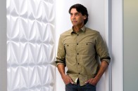 Ketra CEO Nav Sooch at the company’s Austin, Texas, headquarters next to a display that showcases the full spectrum of rich saturated colors and plush pastels that the company’s lighting technology can produce. 