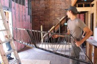 Students with the CUDC’s design/REbuild project help renovate a vacant house