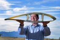 Todd Griffith shows a cross-section of a 50-meter blade. (Photo Courtesy of the Sanders National Laboratories)