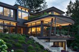 The Stepping House: the deck’s form is inspired as a ship’s bow stretching from the hillside and reaching to the water.