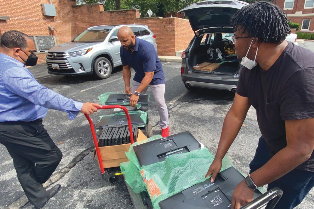 Gensler Chicago donated computer equipment to NOMA and several HBCUs. “Simple donations like this go a long way and have a tremendous impact on both students and small architectural programs across the country,” says Jason Pugh (center), with Jerry Mosby, Howard University Department of Architecture computer support specialist (left), and NOMA recording secretary Julian Owens, NOMA (right).