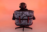 The back panels of the Mike Ford ELO are finished in high-gloss black paint and red edging, with the victim's names hand scribed in white marker.