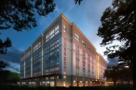 In spite of renderings showing exterior windows, the UC Santa Barbara Munger Hall student dorm rooms will in fact be windowless—an example of skimpflation.