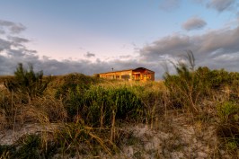 Dune House nestled into the dunes
