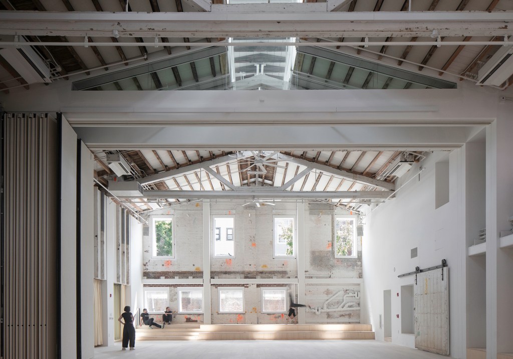 CO Adaptive. Timber Adaptive Reuse Theatre. 2017-21. View of the double-height assembly space at The Mercury Store.