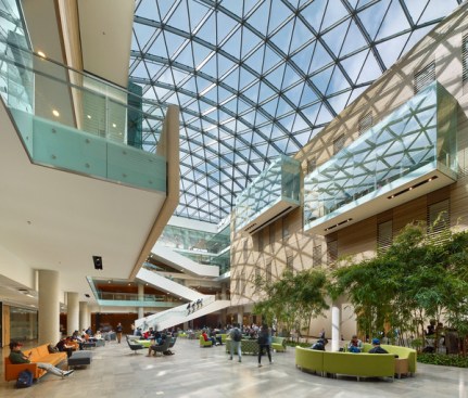 The atrium's freeform fritted glazing spans the entire 140-foot by 70-ft space.
