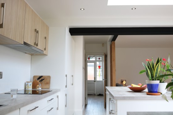 Black painted exposed steel beams create strong architectural features.