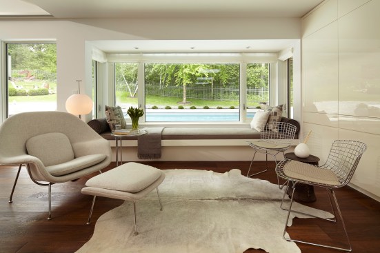 Remodel of Edina Mn residence, PK architects, Streeter and Associates, Andrew Flesher Interiors, ©Karen Melvin Photography, modern, contemporary, white, white kitchen, pizza oven, fireplace modern, monochromatic, woods, woodfloor, modern lamps, feather chandelier, feather pendant, poolside, Womb Chair, wire chair, remodel, remodel modern, architecture minnesota, AM cover