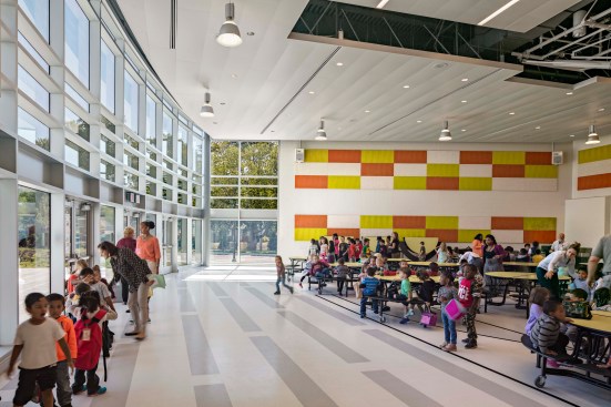 A multipurpose gathering space, which can serve as cafeteria, gym or theater is also the perfect spot for students working with community partners or mentors on various projects or presentations. Floor to ceiling glass wall allows landscape to be part of the interior environment.