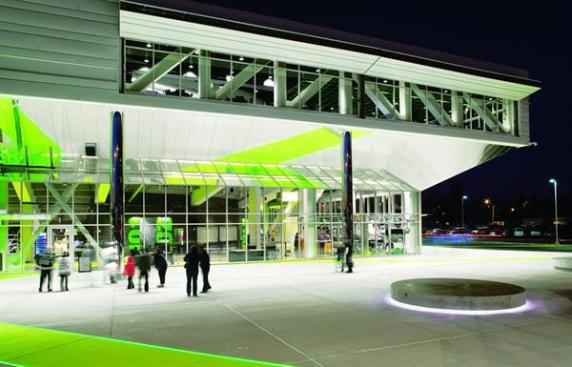 Kent Event Center The windows that penetrate the metal siding over the entrance belong to the club lounge. Located at the southwest corner, the lounge has expansive windows that offer a view of Mount Rainier. Natural light from the windows reaches into the bowl, but during events, shutters made from airplane hangar doors block the light. Also on this second level are VIP suites, crucial to the ShoWare Center?s financial model, that run the length of the ice sheet on either side.
