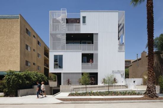 749+Cloverdale%27s+layered+facade+conceals+balconies+that+serve+as+exterior+circulation+for+the+complex.
