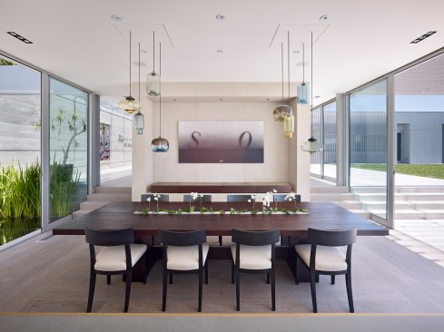 Clad in glass, but shielded from the sun’s intensity by a series of custom-designed vertical louvers