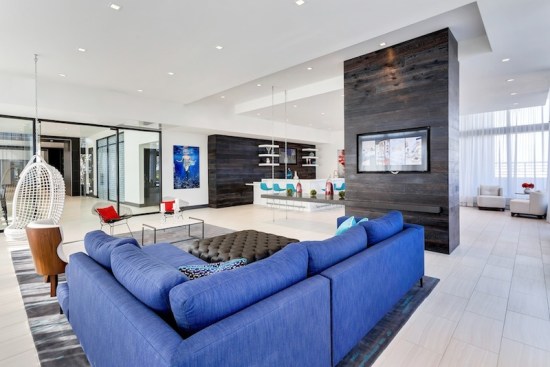 Club Room- The room’s interior design echoes the artwork with dark blues and teals on carpeting and seating areas, imitating the colors on the photograph’s deep turquoise waters.