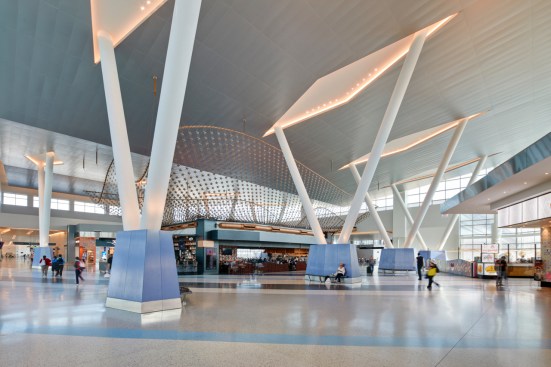 Central concourse 'hub' features soaring 48-foot V columns, which support the wing-inspired  roof above.