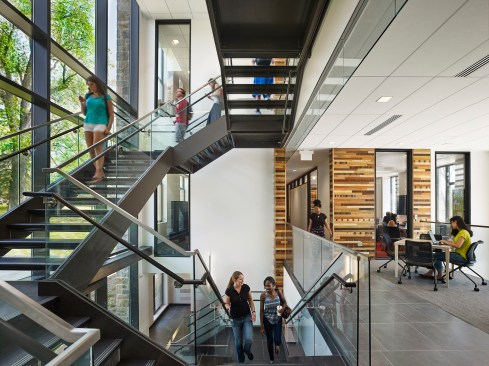 The main stairway is alive with activity, meant to be a place of interaction among students and between students and faculty.