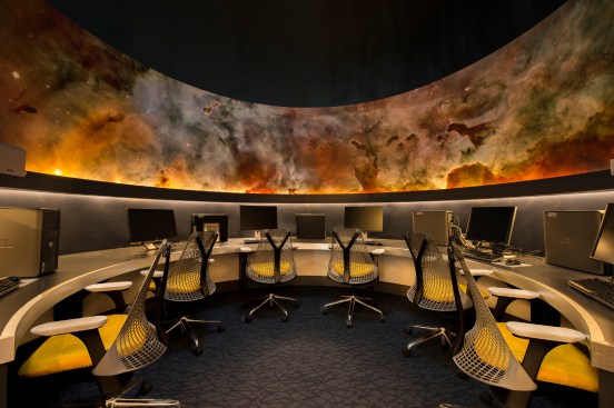 The astronomy room control center with its Hubble telescope photographs of the universe.