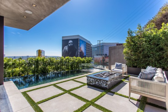 View toward Sunset Blvd. and an infinity edge pool over the cliff. 