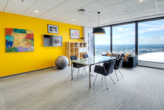 One of three conference rooms that is reserved as the "brain storming room" including alternative seating options and brighter colors to ignite creative thinking.