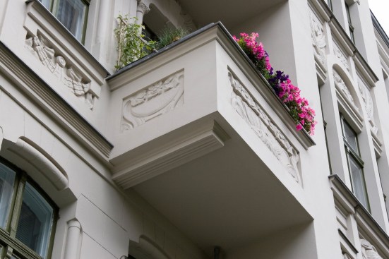 stucco facade of the front building