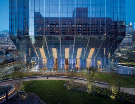 West Base and Park at Dusk - The building's narrow base and elevator core open the majority of the site - more than 75% - as a public landscaped park, plaza and riverwalk.
