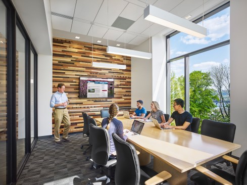 A seminar room features one of the "world wood" with wood salvaged from around the world.