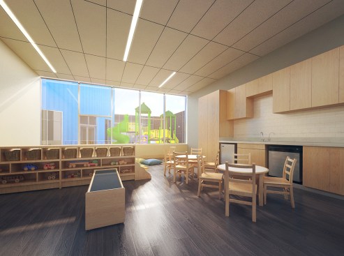 Interior view of a day care classroom with the outdoor play area beyond.