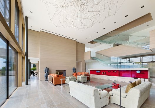 Swiss residence living area and glass stair
