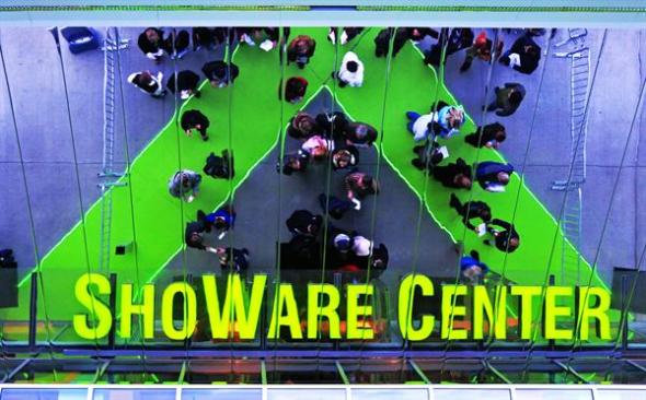 The ShoWare Center's lettering above the main entrance is a reflection of the sign installed horizontally below the soffit.