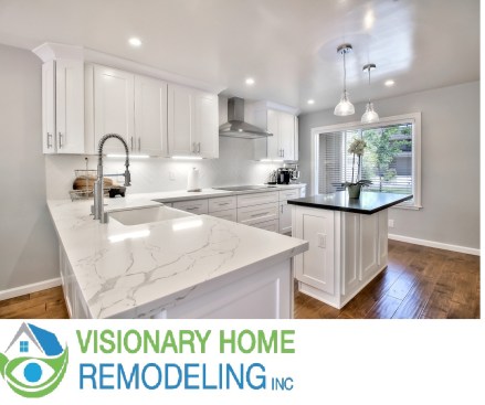 White shaker cabinet, Open space kitchen with quartz counter top. 
Wood flooring 