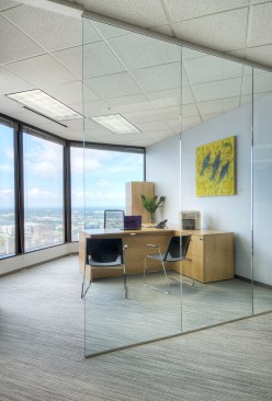 Private offices overlooking the city are faced with glass to allow natural light to permeate into the open office area. Office suites for the private offices were selected from Haworth.