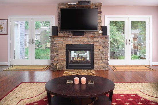 Double-sided natural stone fireplace