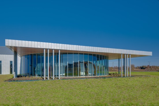 The building offers an almost 360-degree view of the surrounding solar panel array.
