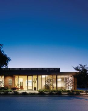The institutional existing brick facade of Dosart Development Co. was opened up on the street side to allow in natural light while still providing a degree of privacy.